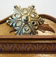 One of the brass and wood ornaments