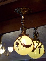 The restored globe lamps in the front of the parlor